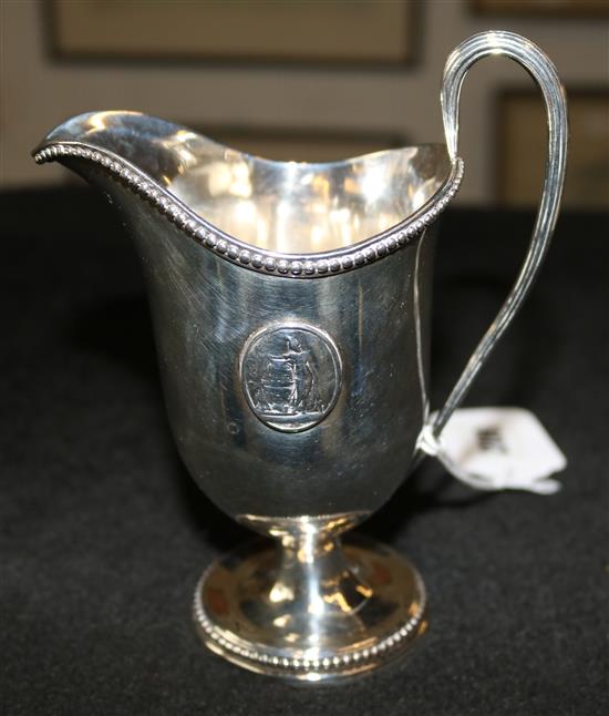 A George III silver helmet cream jug